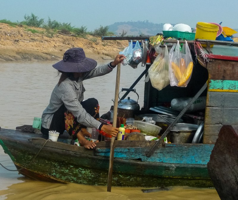 tonle sap woman on boat