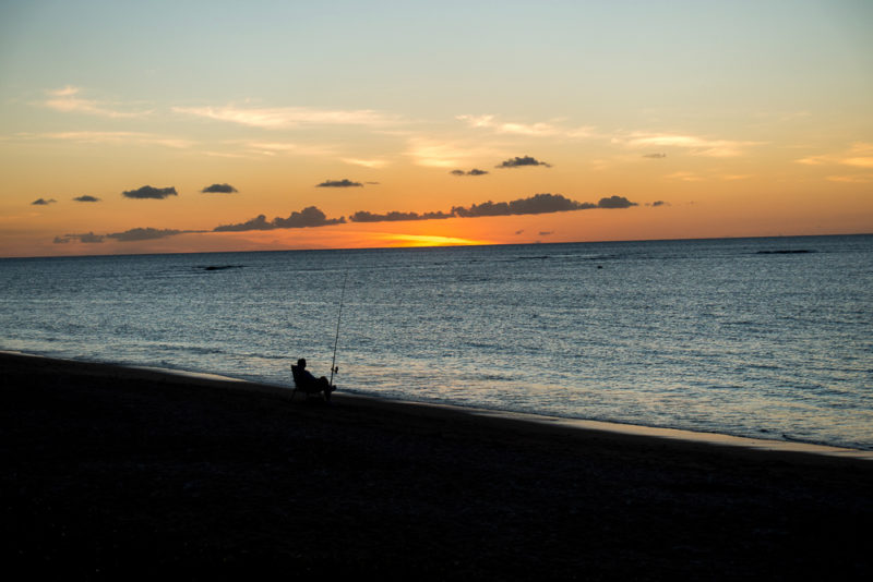 hawaii fisherman by sunset